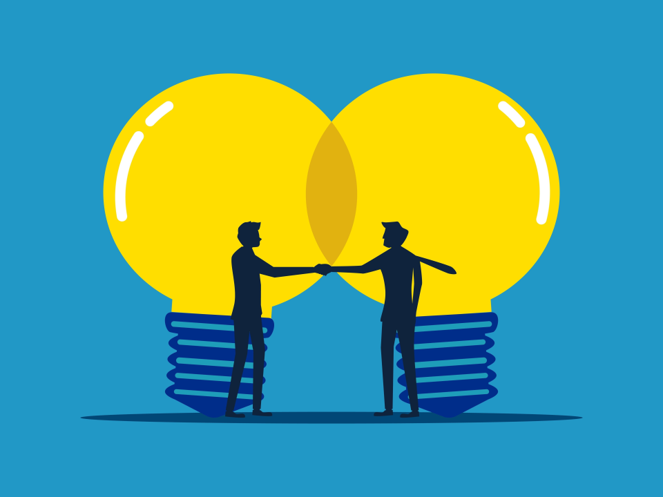 men shaking hands with lightbulbs